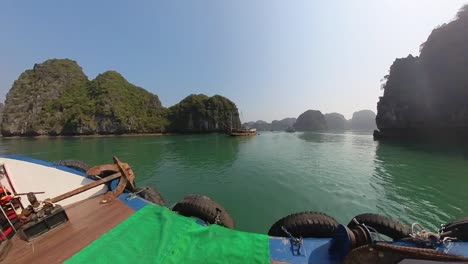 Boat-ride-in-small-cruse-ship-alongside-both-mountains