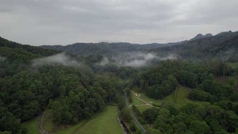 Fog-Clouds-Over-Serene-Hinterland-Oasis-With-Lush-Rainforest-In-The-Currumbin-Valley,-Queensland,-Australia