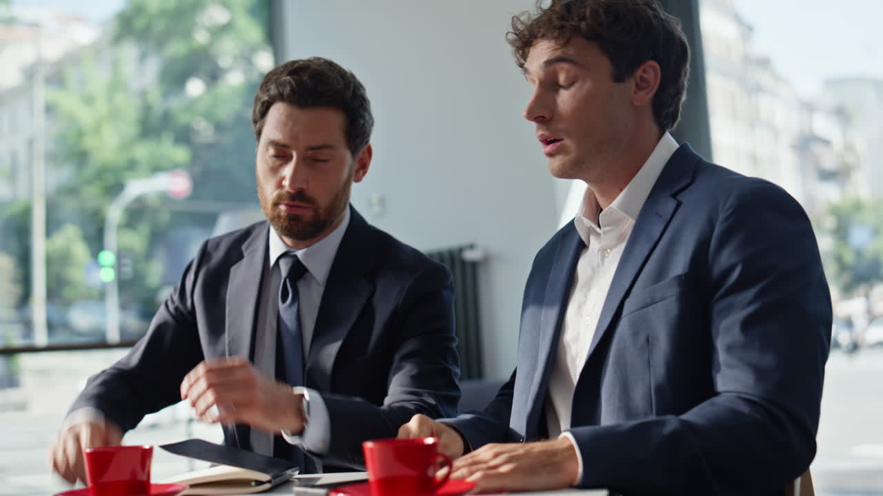 Nervous manager ending call reacting bad news working with colleague closeup