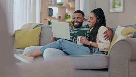 couple, laptop and relax with coffee on sofa