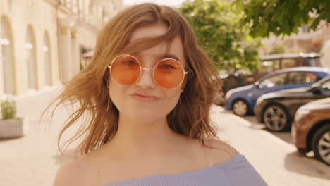 young woman outdoors with sunglasses