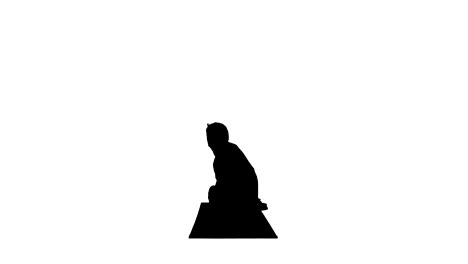 silhouette young man doing squat with twist and bend yoga