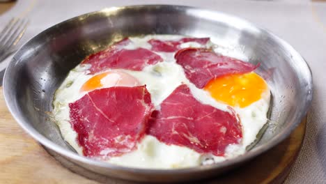 turkish breakfast with fried eggs and smoked meat