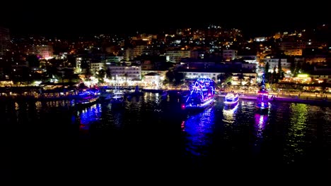 beautiful bay of saranda at night illuminated by promenade lights, with anchored tour ships creating a magical summer vacation scene