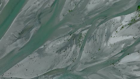 rees river delta with slow flowing glacial water through floodplain, serpentine shape, top down