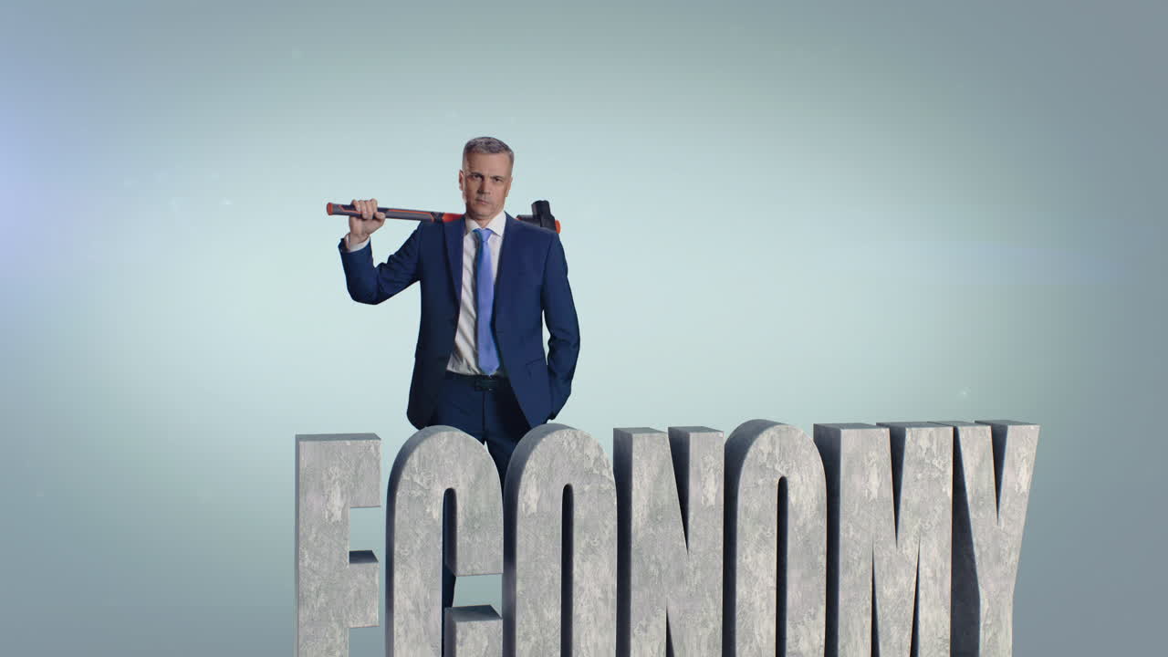 Middle Aged Businessman Breaking Economy Inscription Zoom out View of Mature Man in Suit Hitting Stone Economy Inscription with Hammer against Gray Background