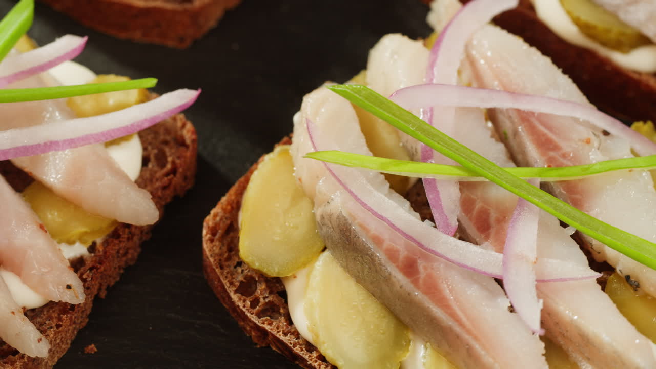 Herring Sandwiches with Dill Pickles, Sour Cream, and Red Onion