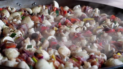 Steaming grilled vegetables with mushrooms and peppers