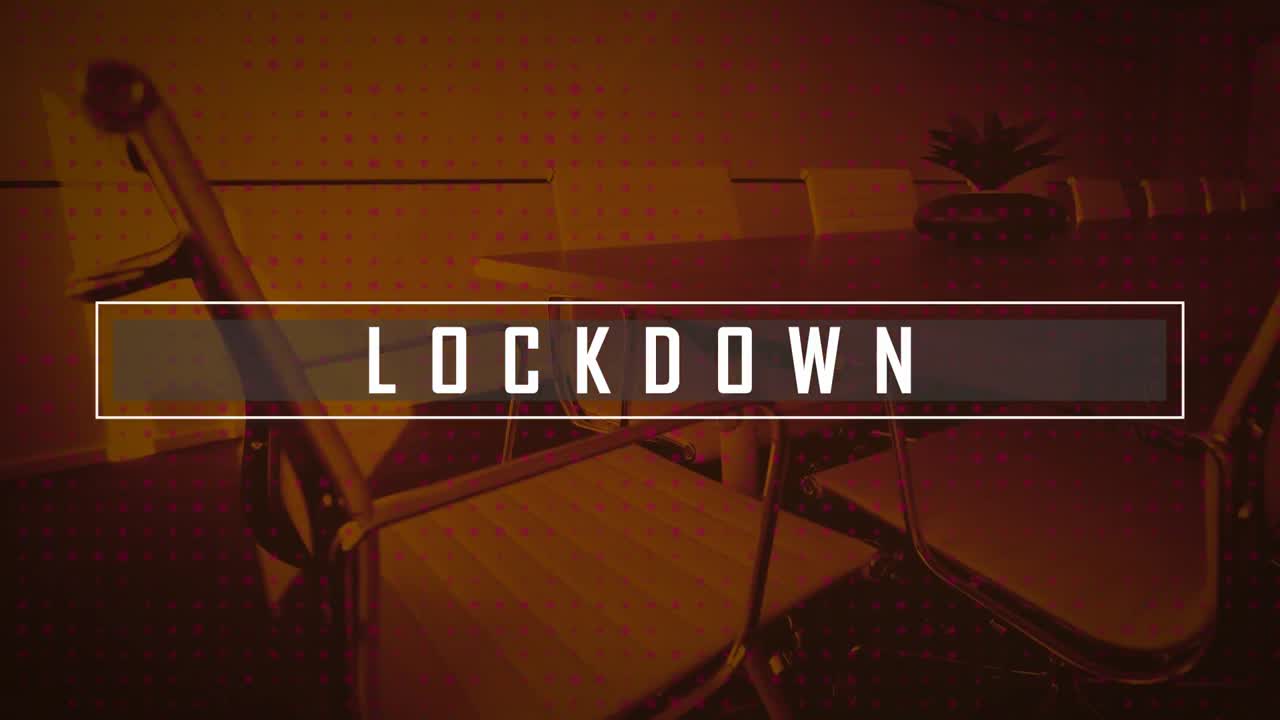 Lockdown text banner against rows of multiple dots against empty office