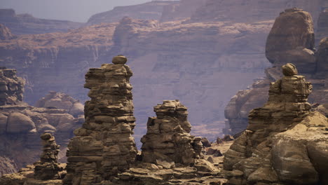 unique rock formations rise from the desert floor in a remote canyon landscape