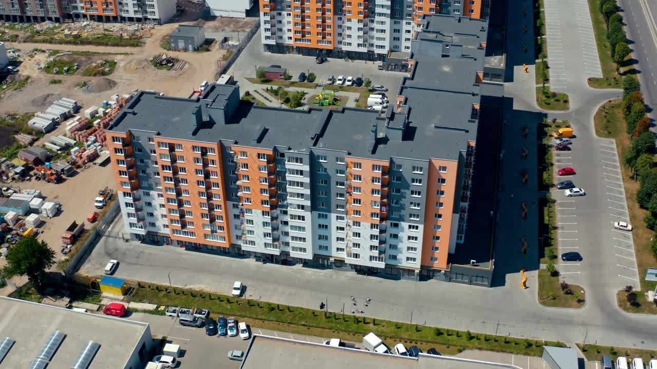 New modern apartment building. Multi-storey architecture in the city. New urban housing. Residential block of flats. Aerial view. Top down.