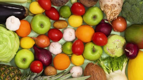 layout full with fresh and organic fruits and vegetables sorted on the table. stop motion flat lay