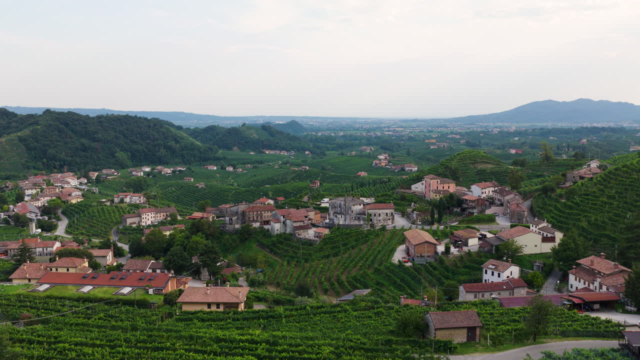 Santo Stefano Village And Vineyards In Prosecco Hills In Treviso Province, Veneto Region, Italy. Aerial Drone Shot