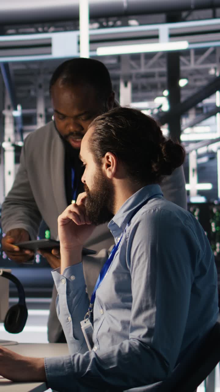 Vertical video Data center system administration team collaborating on AI automation