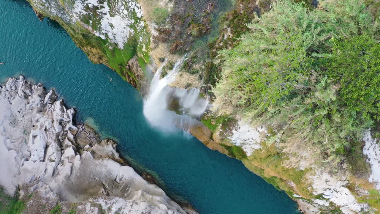 Aerial view of amazing Tamul Waterfall with blue water in San Luis Potosi, Mexico
