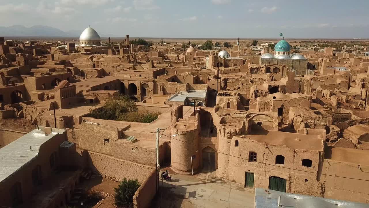 wonderful ancient architecture design in historical city of aqda in Yazd in Iran town in castle adobe houses mud brick structure clay building travel to history and frozen ruins of civilization iran