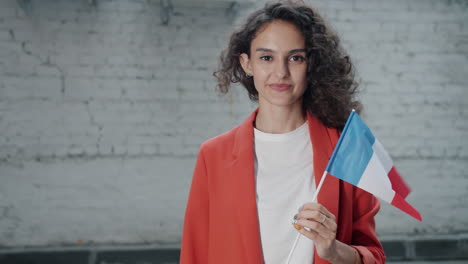 woman holding french flag