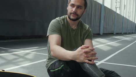 athlete with prosthetic leg resting after training