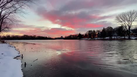 colorful clouds after sunset during winter, in lake of the isles minneapolis minnesota