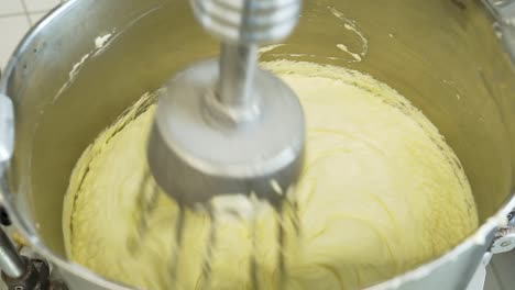 Close-up-of-batter-in-a-big-industrial-mixer