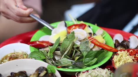 sequential preparation of a fresh seafood salad