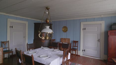 pan shot of vintage scandinavian dining room in antique home setting