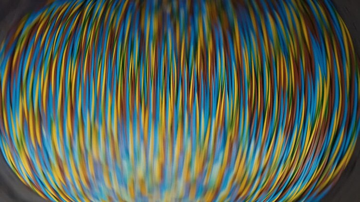 Winding of the electrical cable to the bobbin in the production