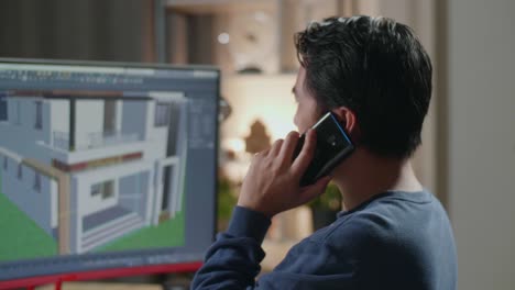 hombre en el teléfono trabajando en un proyecto de diseño de casa