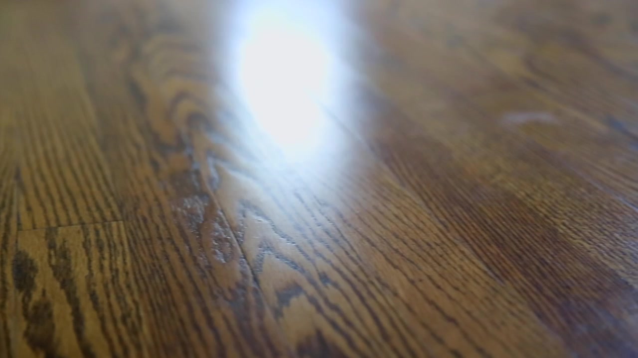 Camera Slides Along Hardwood Floor
