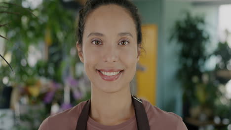 woman smiling at camera in flower shop