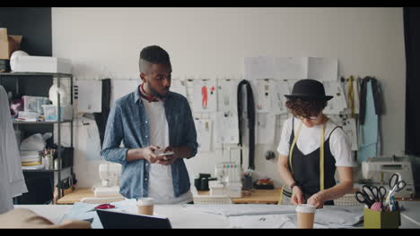 fashion designers collaborating in studio