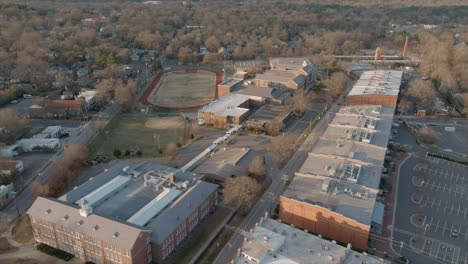 establishing shot of durham neighborhood and soccer field in background in north carolina, usa