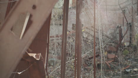 panning shot of rusty beams glimmering against the sun