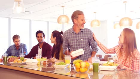 Business-colleagues-having-meal-in-cafeteria