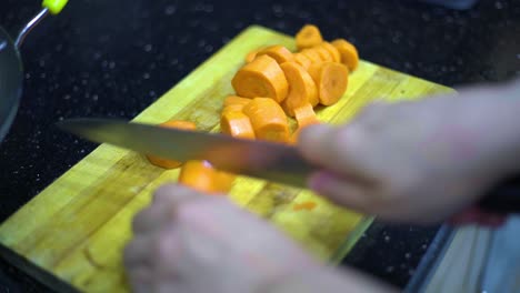 Cutting-the-carrot,-the-preparation-of-vegetable-soup