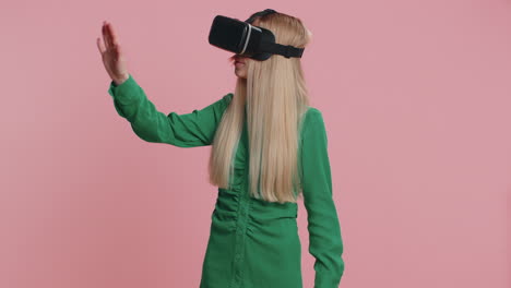 Woman-using-virtual-reality-headset-helmet-app-to-play-realistic-simulation-3D-games,-watching-video