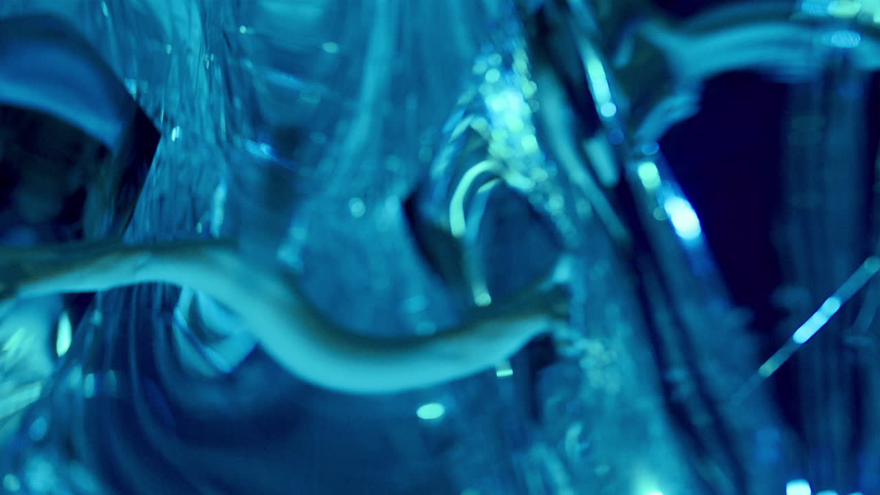 Woman Giving Ethereal Dance Performance Surrounded by Distorted Reflections