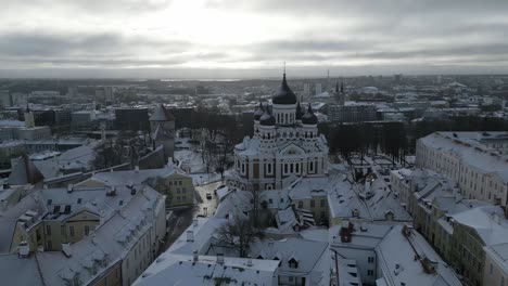 Aerial-view-of-the-churches-in-the-Old-Town-of-Tallinn,-Estonia-in-winter-sunrise