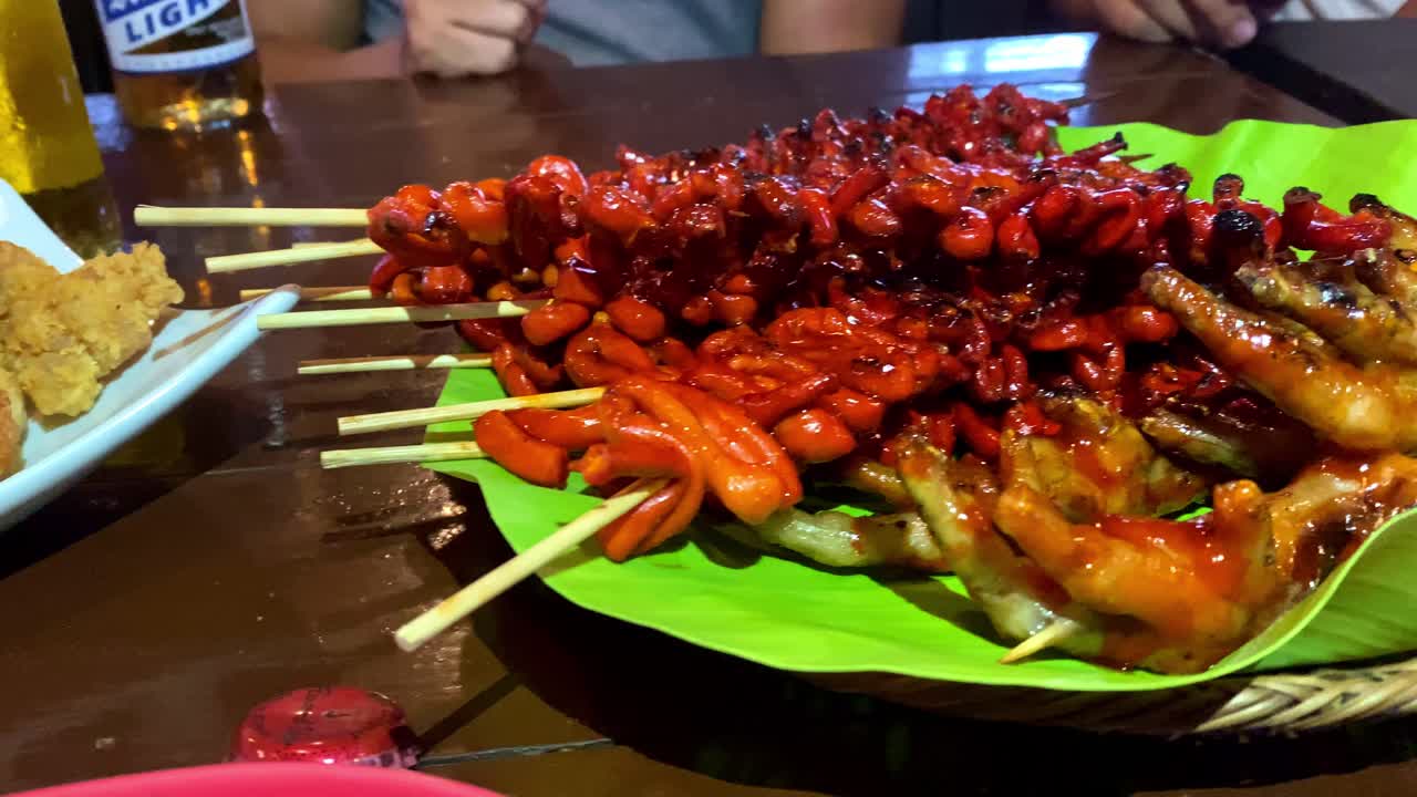Digging into Filipino Street Food - Barbecue Chicken Intestines and Feet