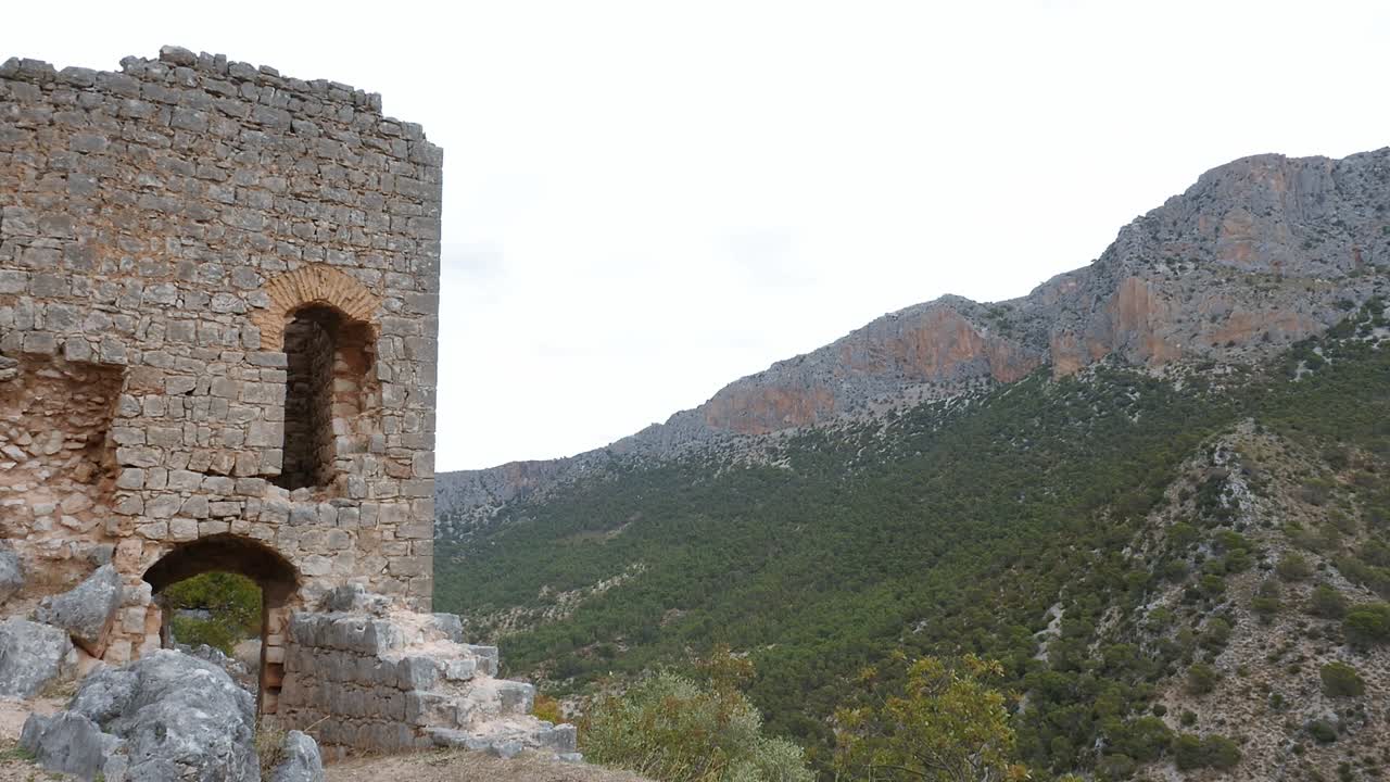 Ruined Otiñar Castle, perched on a hill in the Sierra de Jaén, Andalusia