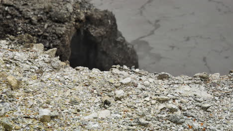 top view of rocky edge and boiling water in the valley in geothermal volcanic