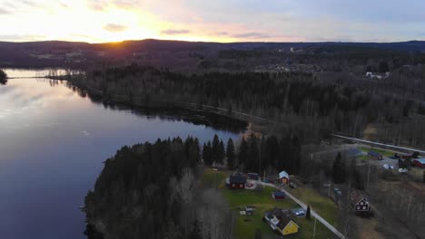 drone footage of sunset by a lake in sweden