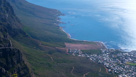 view of twelve apostles and camps bay coastline from table mountain, pan shot