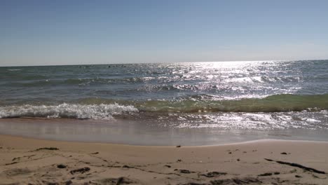 Lake-Michigan-waves-on-beach-in-Muskegon,-Michigan