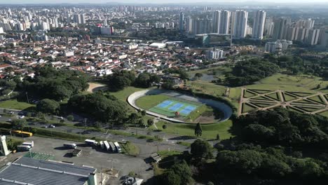 aerial drone fly above botanical garden in curitiba brazil, cityscape green landscape, park around brazilian streets during daylight