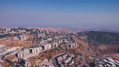 aerial view of a city on dry hills