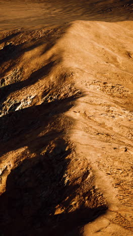 aerial view of red desert with sand dune