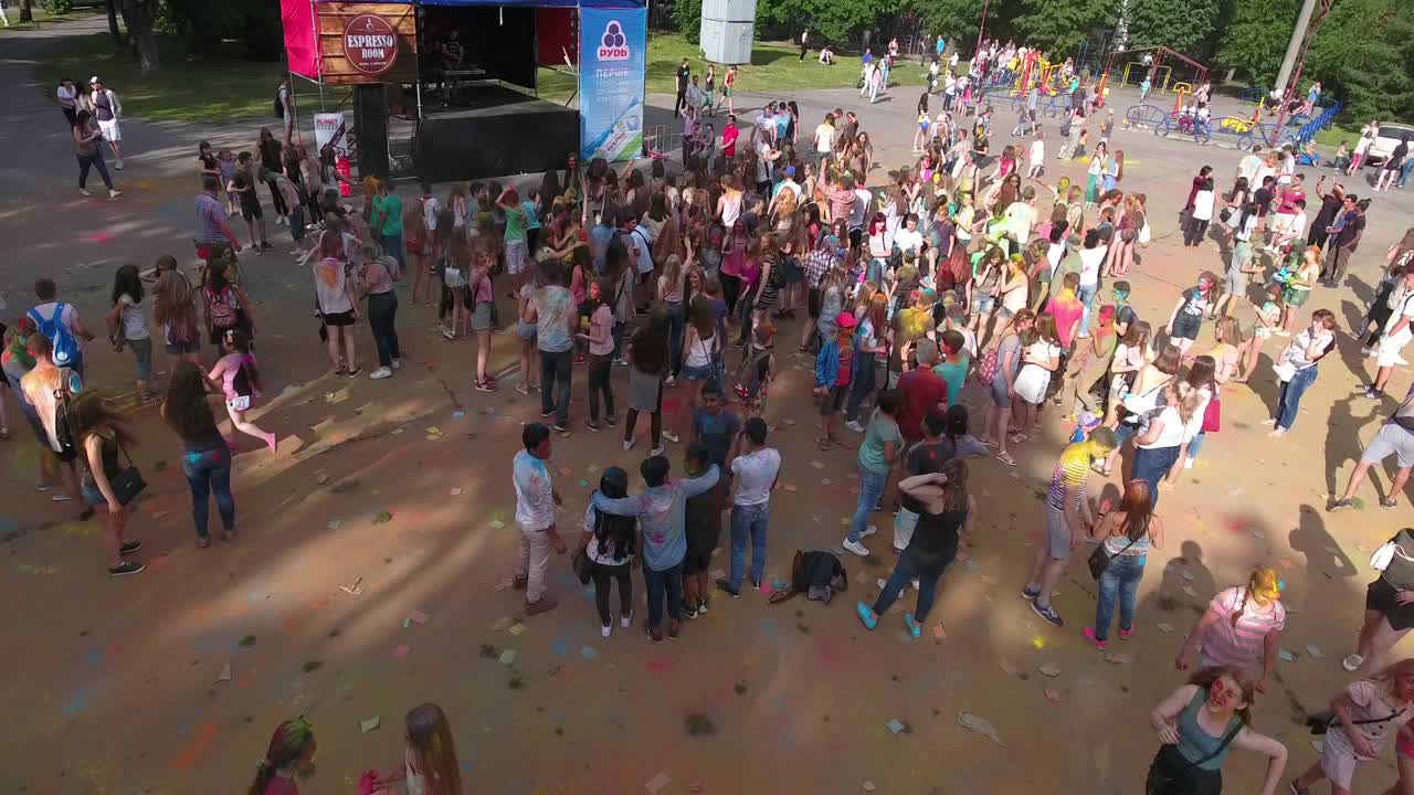Festival Of Color In A City Park. VINNITSA, UKRAINE - JULY 2017: People have fun during the festival of color in a city park in Vinnitsa