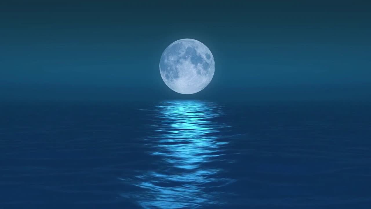 A serene video of a full moon rising over a dark blue sea.
