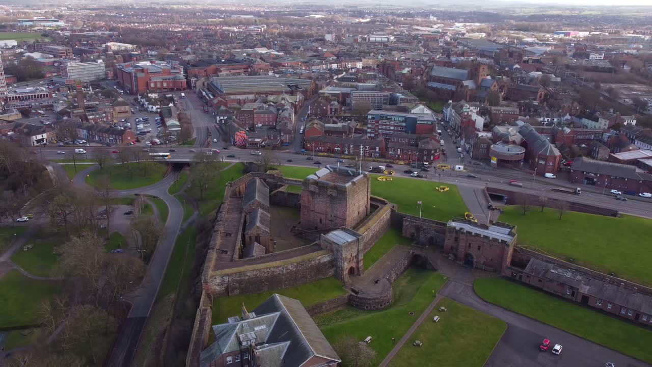 Drone circling Carlisle Castle with Carlisle City Centre in the background